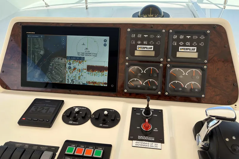 Slide: The Image of Control panel of a 2000 Pacific Mariner 65 Motoryacht with navigation and engine gauges. - 5