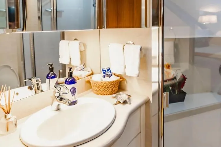 Slide: The Image of Luxurious bathroom in 2000 Pacific Mariner 65 Motoryacht with elegant fixtures and decor. - 60