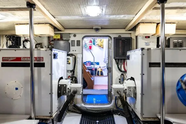 Slide: The Image of Engine room of 2000 Pacific Mariner 65 Motoryacht with visible equipment and control panels. - 63