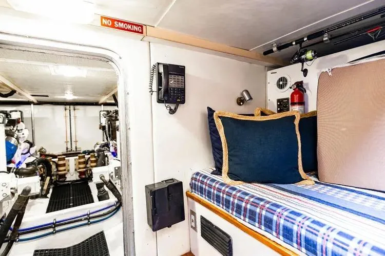 Slide: The Image of Interior of 2000 Pacific Mariner 65 Motoryacht with cozy bed and engine room view. - 65