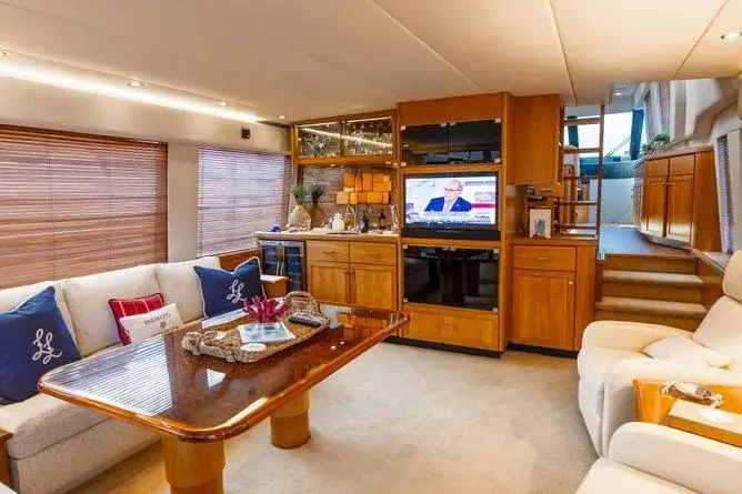 Slide: The Image of Luxurious interior of 2000 Pacific Mariner 65 Motoryacht with elegant furnishings and entertainment center. - 9