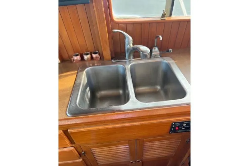 Slide: The Image of Stainless steel double sink in 1987 Monk 36 Trawler kitchen area. - 15