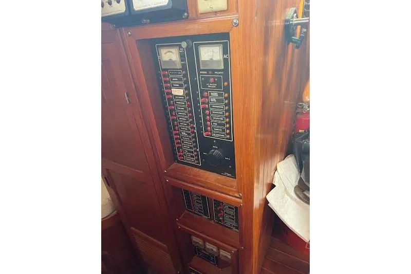 Slide: The Image of Electrical panel of a 1987 Monk 36 Trawler with gauges and switches. - 32