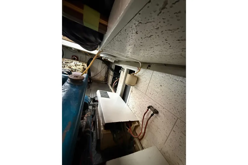 Slide: The Image of Engine room of a 1987 Monk 36 Trawler, showing machinery and wiring. - 33