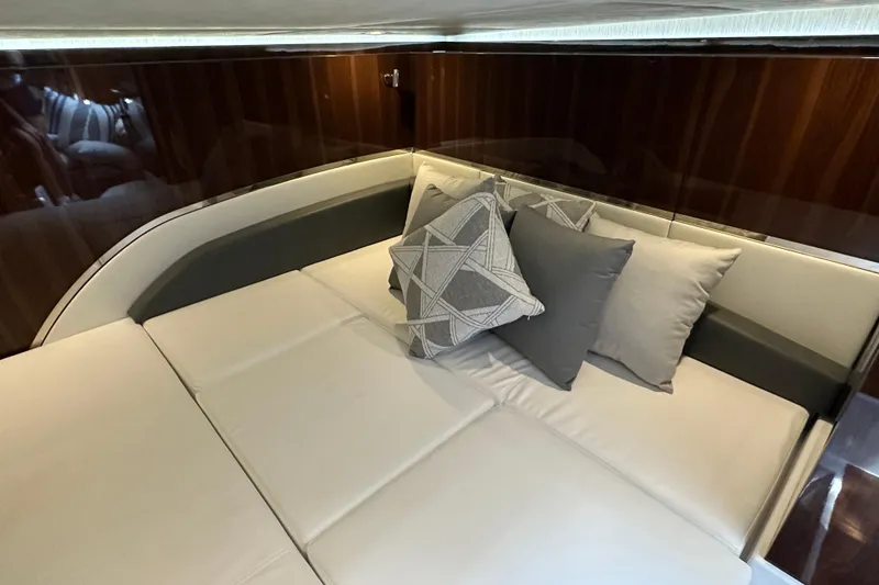 Slide: The Image of Luxurious interior seating with cushions in 2024 Cruisers Yachts 50 GLS. - 24