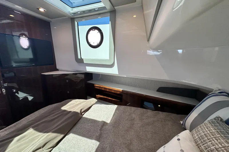 Slide: The Image of Luxurious 2024 Cruisers Yachts 50 GLS cabin interior with modern design and natural light. - 21