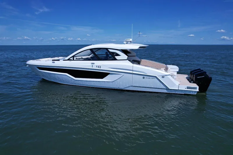Slide: The Image of 2024 Cruisers Yachts 50 GLS on open water, showcasing sleek design and luxury features. - 6