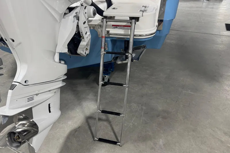 Slide: The Image of 2026 Robalo R270 Center Console boat with ladder and outboard motor. - 5