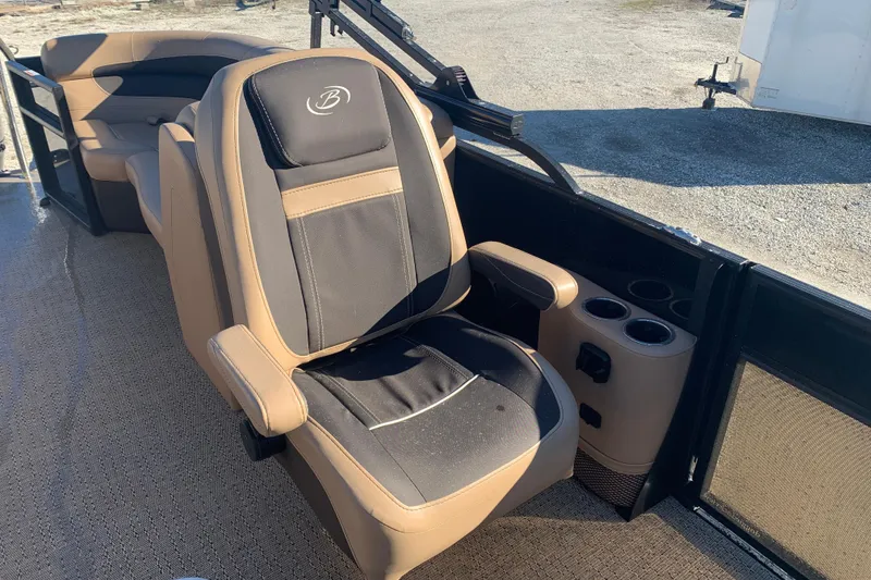 Slide: The Image of 2025 Barletta Cabrio 22QC boat interior with comfortable seating and cup holders. - 13