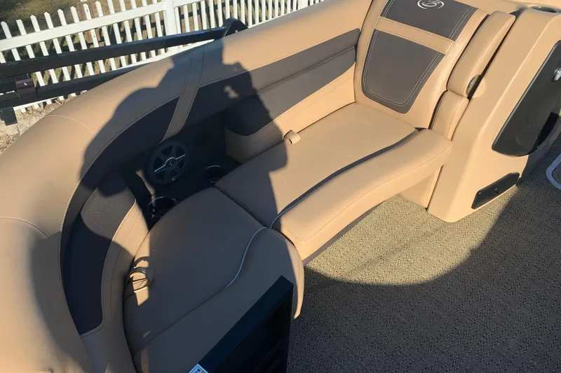 Slide: The Image of 2025 Barletta Cabrio 22QC boat interior with tan seating and cup holders. - 14