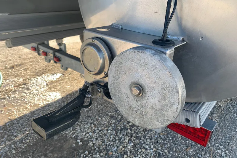 Slide: The Image of Close-up of a 2025 Barletta Cabrio 22QC boat trailer hitch mechanism. - 29