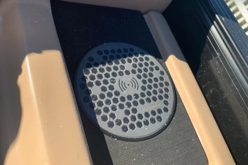 Slide: The Image of Close-up of a wireless charging pad on 2025 Barletta Cabrio 22QC boat. - 9