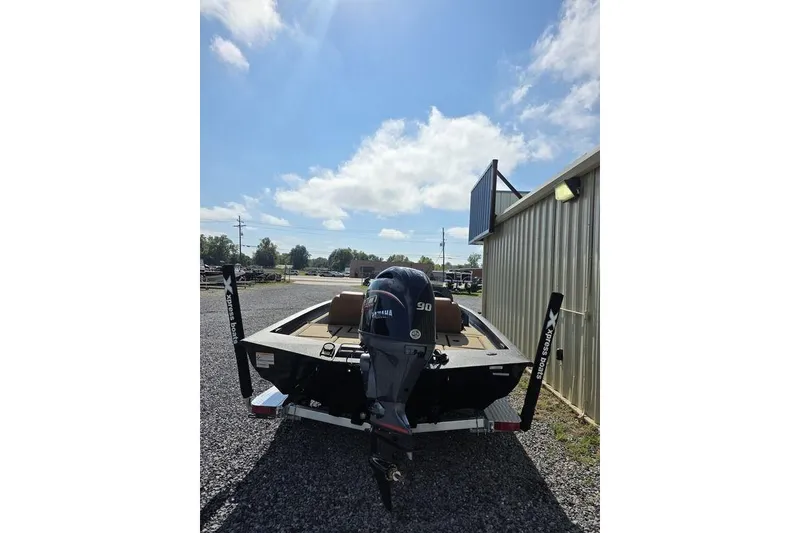 Slide: The Image of 2026 Xpress H17C Crappie boat with Yamaha motor, parked outdoors on gravel. - 12