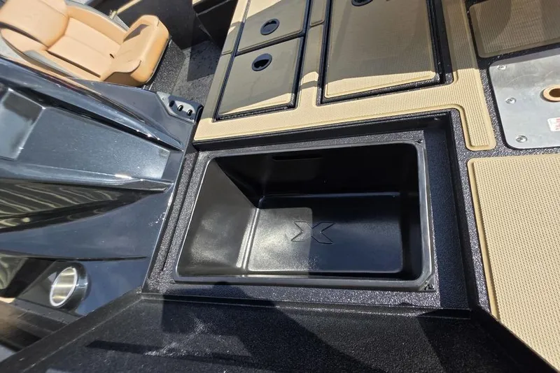 Slide: The Image of 2026 Xpress H17C Crappie boat interior with storage compartments and seating. - 14