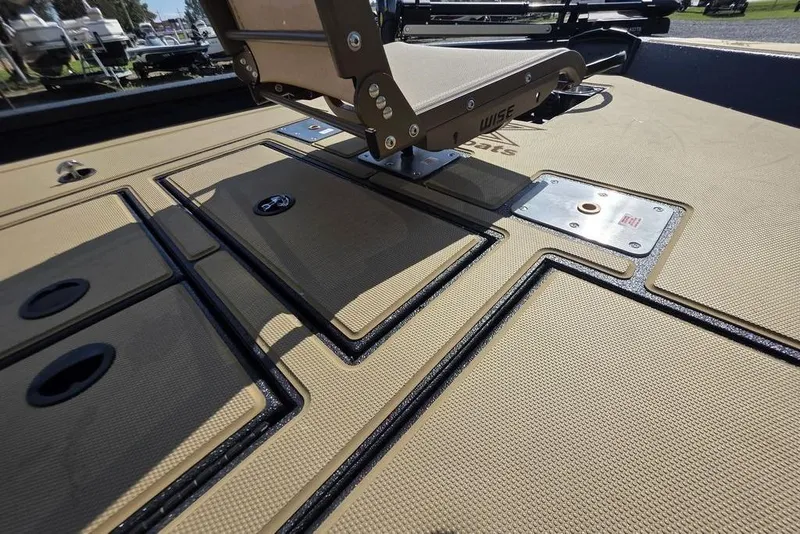 Slide: The Image of 2026 Xpress H17C Crappie boat deck with storage compartments and seat mount. - 15