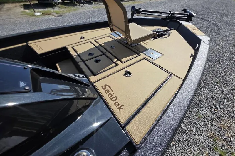 Slide: The Image of 2026 Xpress H17C Crappie boat with SeaDek flooring, featuring storage compartments and seating. - 20