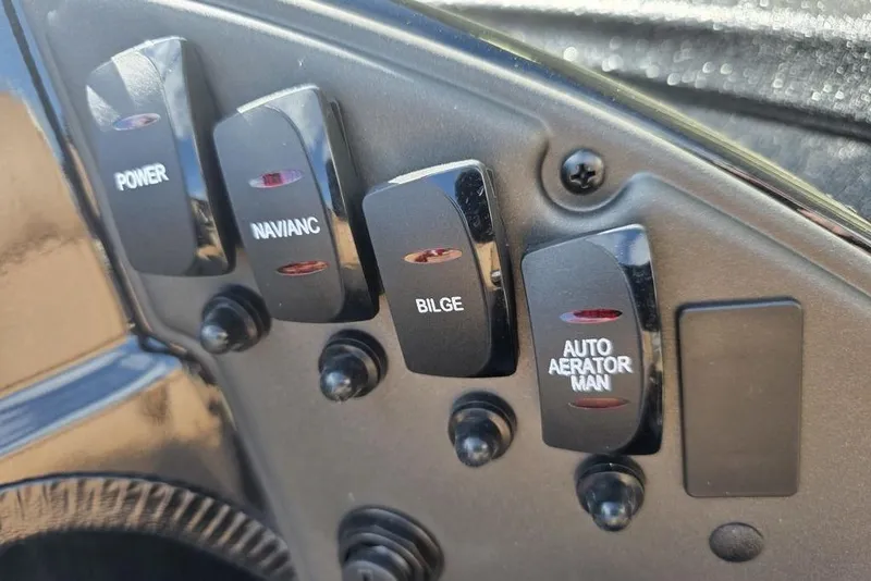 Slide: The Image of Control panel of 2026 Xpress H17C Crappie boat with labeled switches. - 5