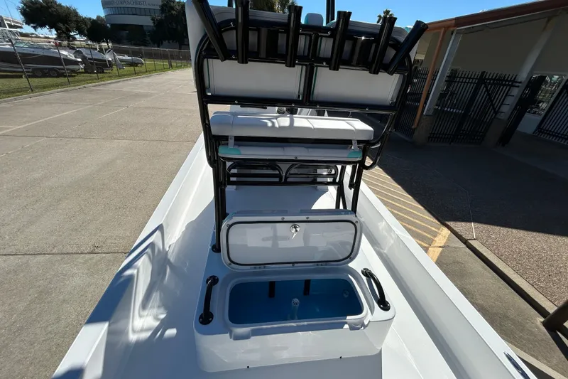 Slide: The Image of 2026 Shallow Sport 22 Sport boat with open storage compartment and seating. - 12
