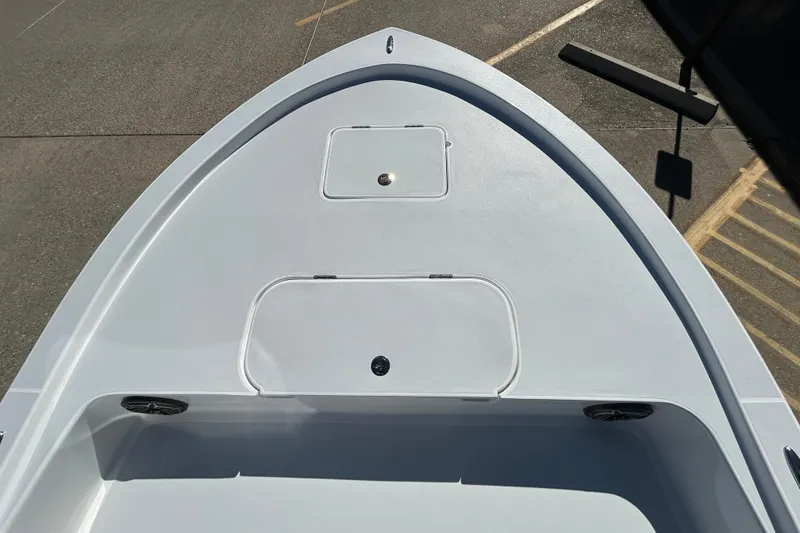 Slide: The Image of Bow view of 2026 Shallow Sport 22 Sport boat, featuring storage compartments. - 16