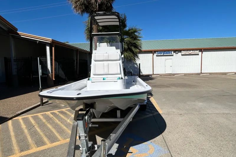 Slide: The Image of 2026 Shallow Sport 22 Sport boat on trailer in parking lot. - 3