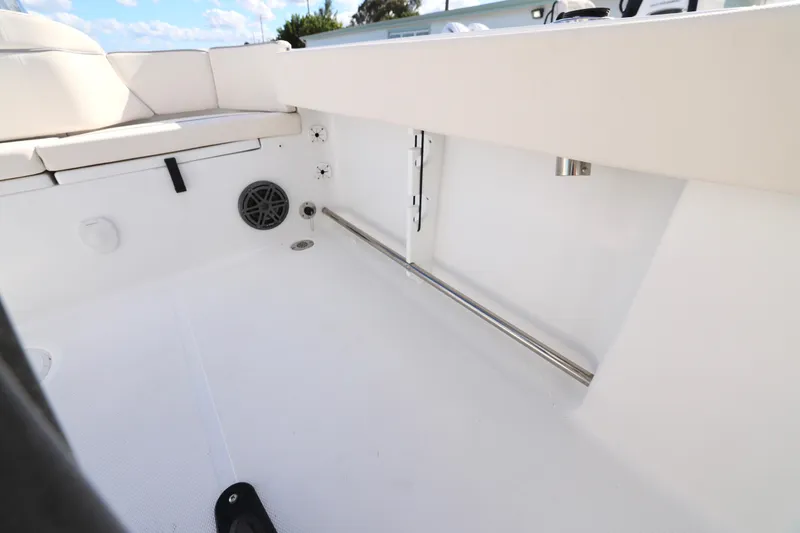 Slide: The Image of 2026 Sea Hunt Ultra 229 boat interior with seating and speaker detail. - 13