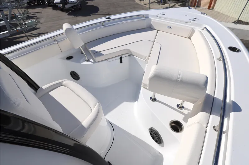 Slide: The Image of 2026 Sea Hunt Ultra 229 boat interior with white seating and modern design. - 3