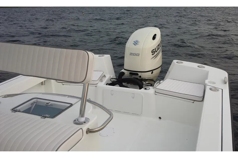 Slide: The Image of 2026 Maritime 233 Defiant boat detail with rod holders in a workshop setting. - 14