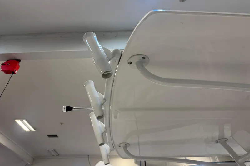 Slide: The Image of 2026 Maritime 233 Defiant boat interior, showcasing sleek white seating and storage compartments. - 15