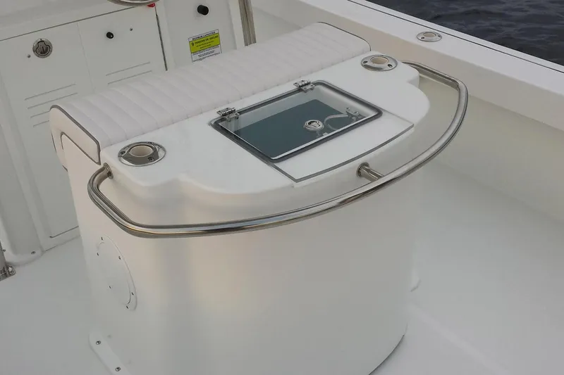 Slide: The Image of 2026 Maritime 233 Defiant boat with Yamaha engine in a workshop setting. - 6