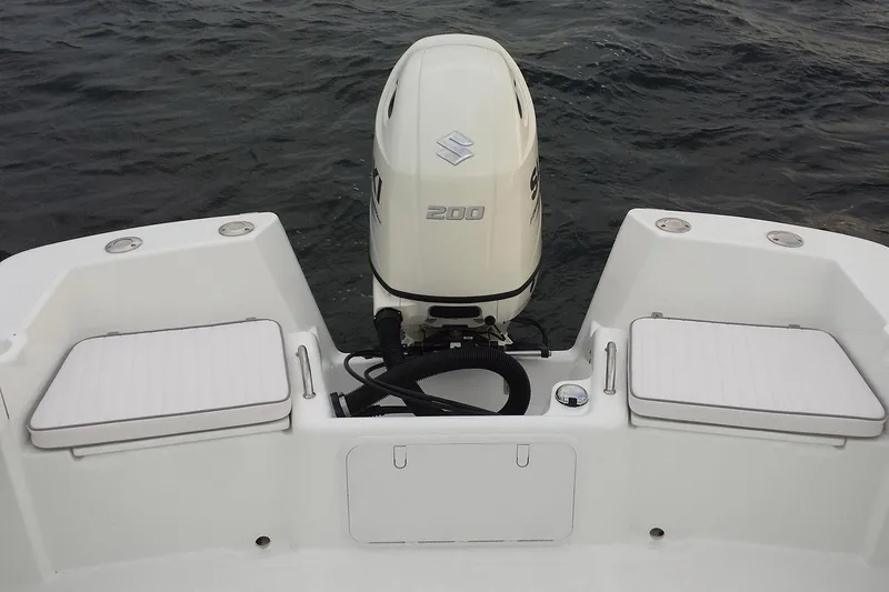 Slide: The Image of Interior view of 2026 Maritime 233 Defiant boat, featuring clean white deck and seating. - 8