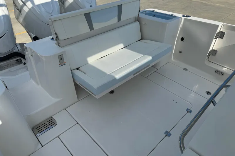 Slide: The Image of 2025 Robalo R360 Center Console boat with foldable seating and spacious deck. - 13