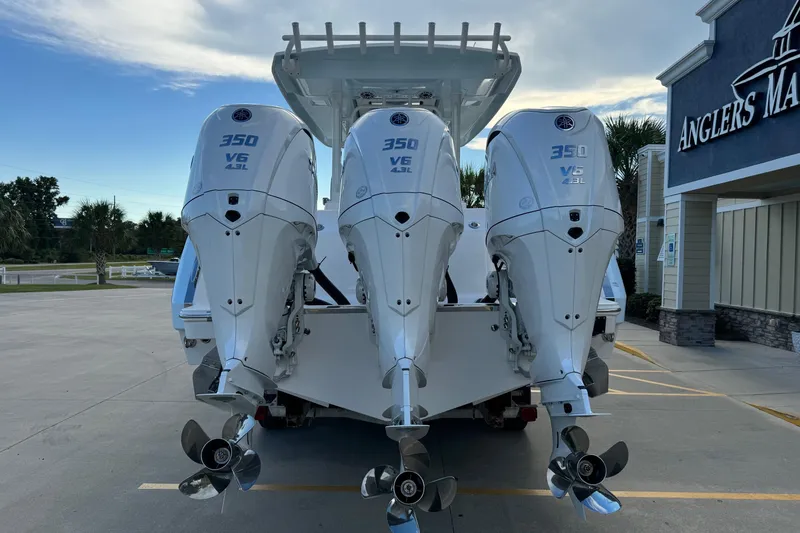 Slide: The Image of 2025 Robalo R360 Center Console with triple 350 V6 engines at Anglers Marine. - 6