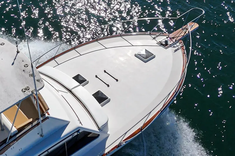 Slide: The Image of Aerial view of 1984 Post 43 yacht cruising on sparkling water. - 17