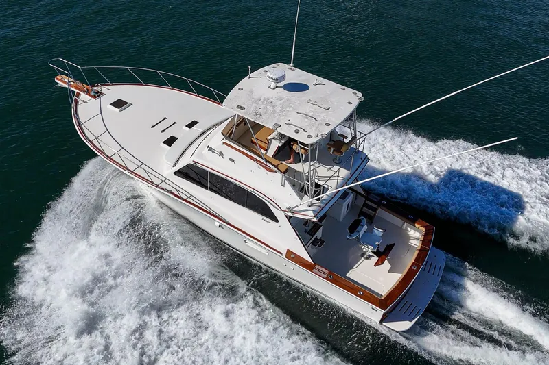 Slide: The Image of Aerial view of 1984 Post 43 yacht cruising on open water. - 18