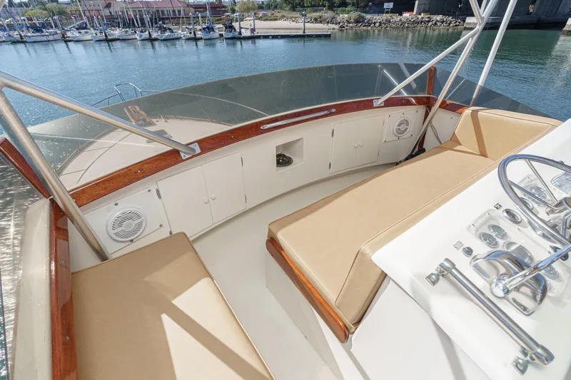 Slide: The Image of Flybridge of 1984 Post 43 yacht with beige seating and marina view. - 19