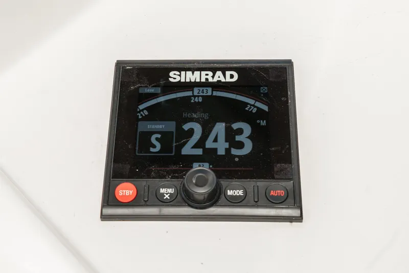 Slide: The Image of Simrad navigation display showing heading 243 on a Post 43, 1984 model. - 26