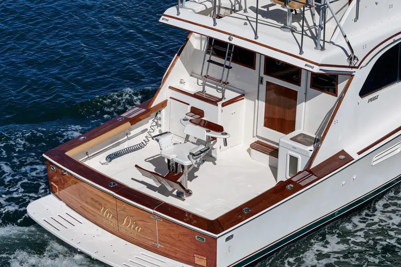 Slide: The Image of 1984 Post 43 yacht with wooden accents cruising on the ocean. - 29