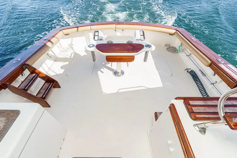 Slide: The Image of Cockpit of 1984 Post 43 boat with wooden accents and ocean view. - 34