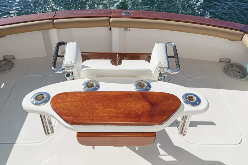 Slide: The Image of Fishing chair on 1984 Post 43 boat with wooden table and rod holders. - 39