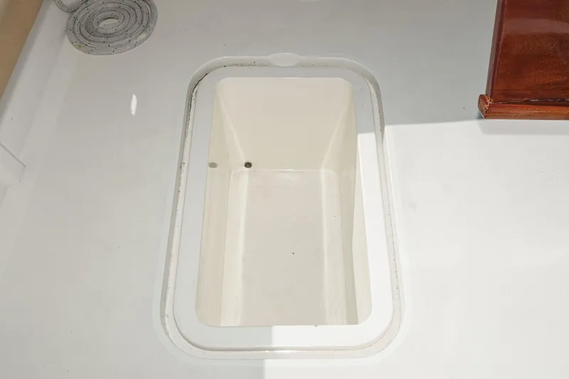 Slide: The Image of Open storage compartment on a 1984 Post 43 boat deck. - 42