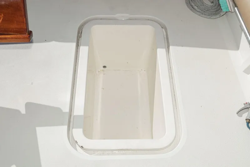 Slide: The Image of Open storage compartment on 1984 Post 43 boat deck. - 43