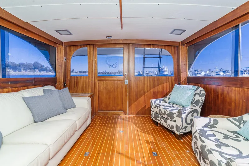 Slide: The Image of Luxurious 1984 Post 43 yacht interior with elegant wood paneling and comfortable seating. - 46