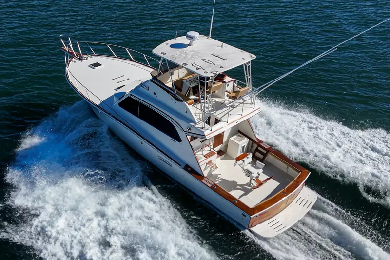 Slide: The Image of 1984 Post 43 yacht cruising on open water, aerial view. - 7