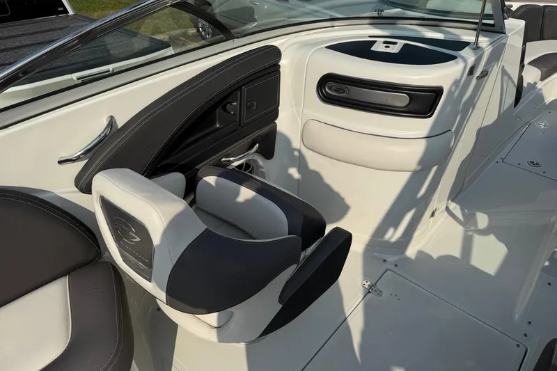 Slide: The Image of 2023 Crownline 260 SS boat interior with sleek seating and modern design. - 14