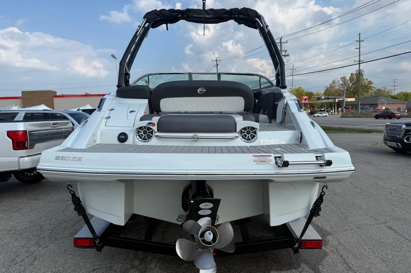 Slide: The Image of 2023 Crownline 260 SS boat rear view, showcasing sleek design and powerful engine. - 2