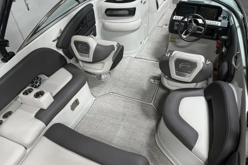 Slide: The Image of 2023 Crownline 260 SS boat interior with modern seating and steering console. - 5
