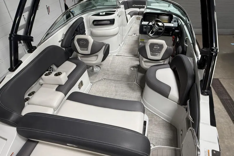 Slide: The Image of 2023 Crownline 260 SS boat interior with luxurious seating and modern dashboard. - 6