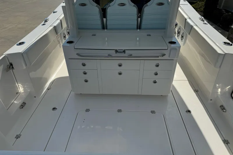 Slide: The Image of 2025 Robalo R360 Center Console boat interior with seating and storage compartments. - 11