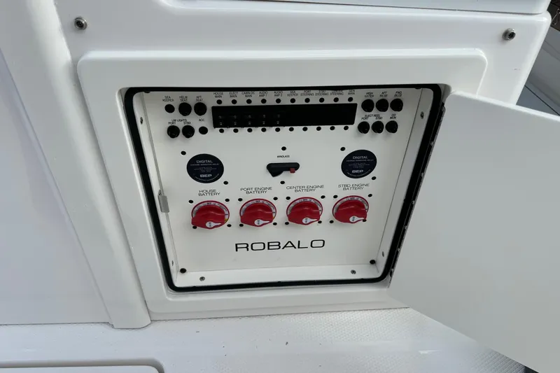Slide: The Image of Control panel of 2025 Robalo R360 Center Console boat with battery switches. - 19