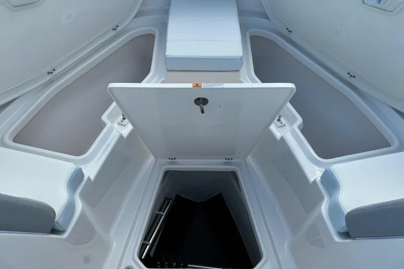 Slide: The Image of 2025 Robalo R360 Center Console boat interior with open storage compartments. - 32